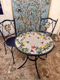 Wrought Iron humming bird Mosaic Patio table with faux leather upholstered chairs